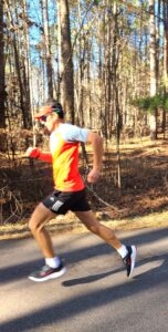 Dr. Oscar Cornelio running in the woods.