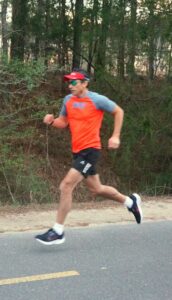 Dr. Oscar Cornelio running in a trail.