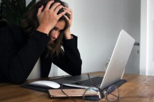 woman frustrated in from of a computer